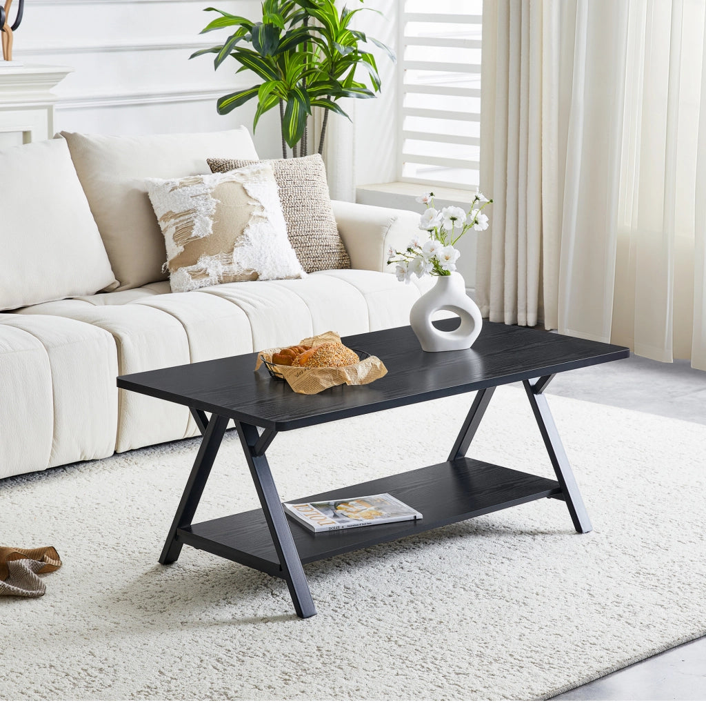 Tavolino da salotto ULEVR 110x57x44,5 cm con ripiano inferiore, MDF e struttura in metallo, nero effetto legno