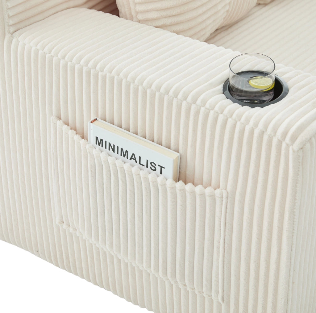 Pouf sofa in velluto a coste beige con 2 cuscini e tasche laterali; 151x133x64 cm