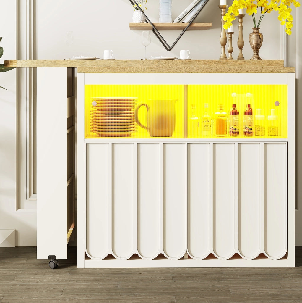 Tavolo bar 135-205x39x100 cm con ruote; LED e vani contenitore in MDF e vetro bianco