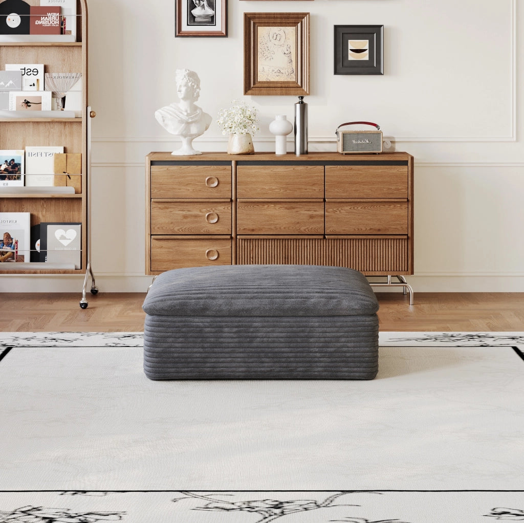 Divano modulare in tessuto grigio scuro con supporto in schiuma; design componibile