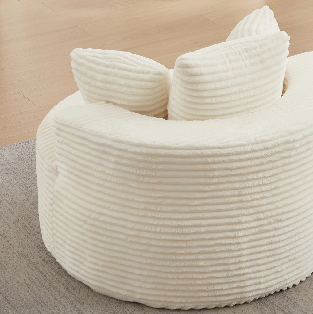 Poltrona lounge rotonda beige in velluto a coste con tre cuscini