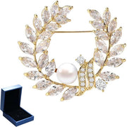 Broche per donna in zircone con decorazione a forma di ramoscello di olivo, dimensioni 4*4.17cm, materiale gesso, con applicazione in oro.
