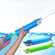 Trade Shop - Tubo Spara Acqua 33x5cm 90ml A Forma Di Squalo Pompa Giocattolo 2 Colori 6722076 -