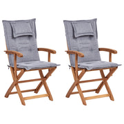 Set di 2 sedie da pranzo da giardino Legno chiaro con cuscino grigio Struttura in legno di acacia Design rustico pieghevole