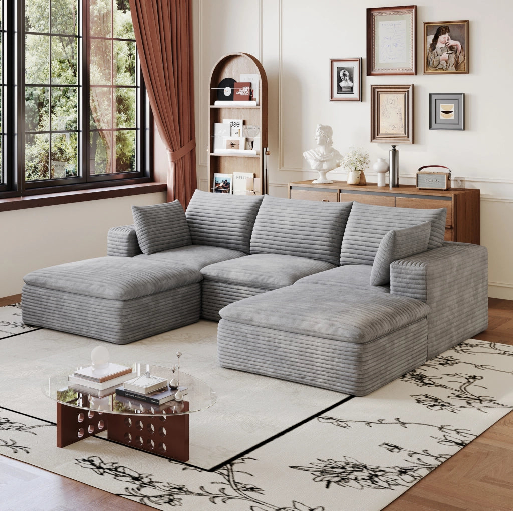 Divano modulare ULEVR in tessuto grigio con supporto interamente in schiuma e design configurabile