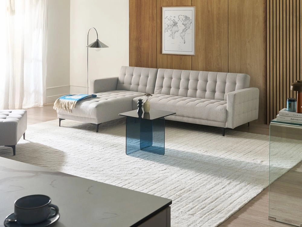 Divano letto angolare in tessuto grigio chiaro capitonné in tessuto moderno a L componibile versione destra
