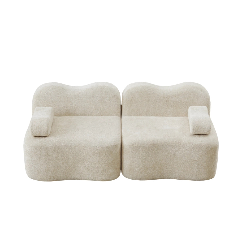 Divano modulare senza braccioli a forma ondulata con seduta profonda e cuscino bracciolo mobile in velluto beige
