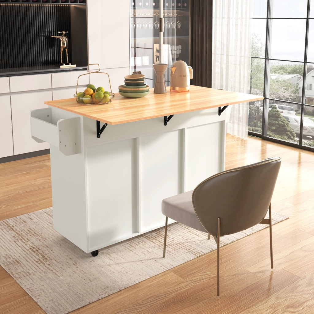 Isola da Cucina Mobile 139x46/71x91;5 cm Bianca con Piano Ribaltabile; 3 Cassetti; Ruote e Gambe in Legno
