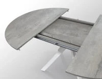 PAZZO DESIGN Tavolo Allungabile con Gambe Incrociate rotondo, Made in Italy, Basamento bianco, Grigio cemento