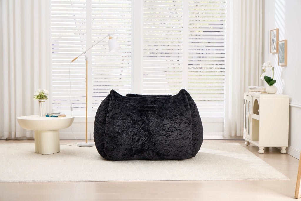 Pouf poltrona in pelliccia sintetica con poggiapiedi, schienale ergonomico e imbottitura in schiuma, nero