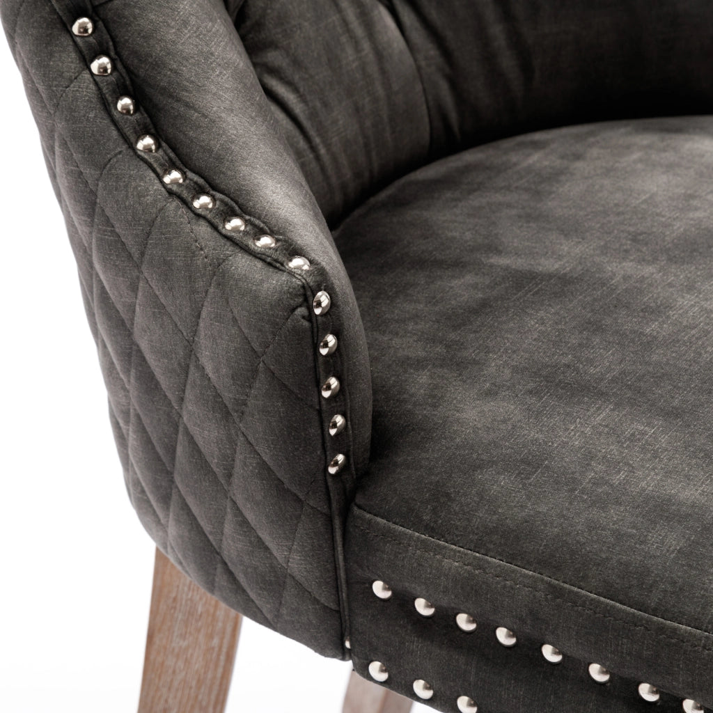 Sedia da pranzo imbottita con gambe regolabili, borchie decorative e anello posteriore, in velluto grigio