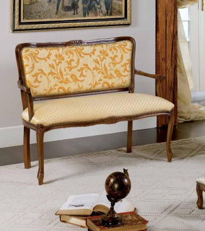 Divanetto imbottito in legno massello intagliato con fregi