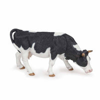 Papo - Black and white grazing cow
