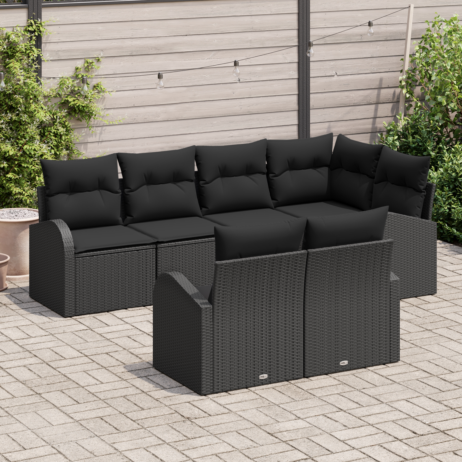 Set di divano da giardino 7 pezzi con cuscini in polyrattan nero
