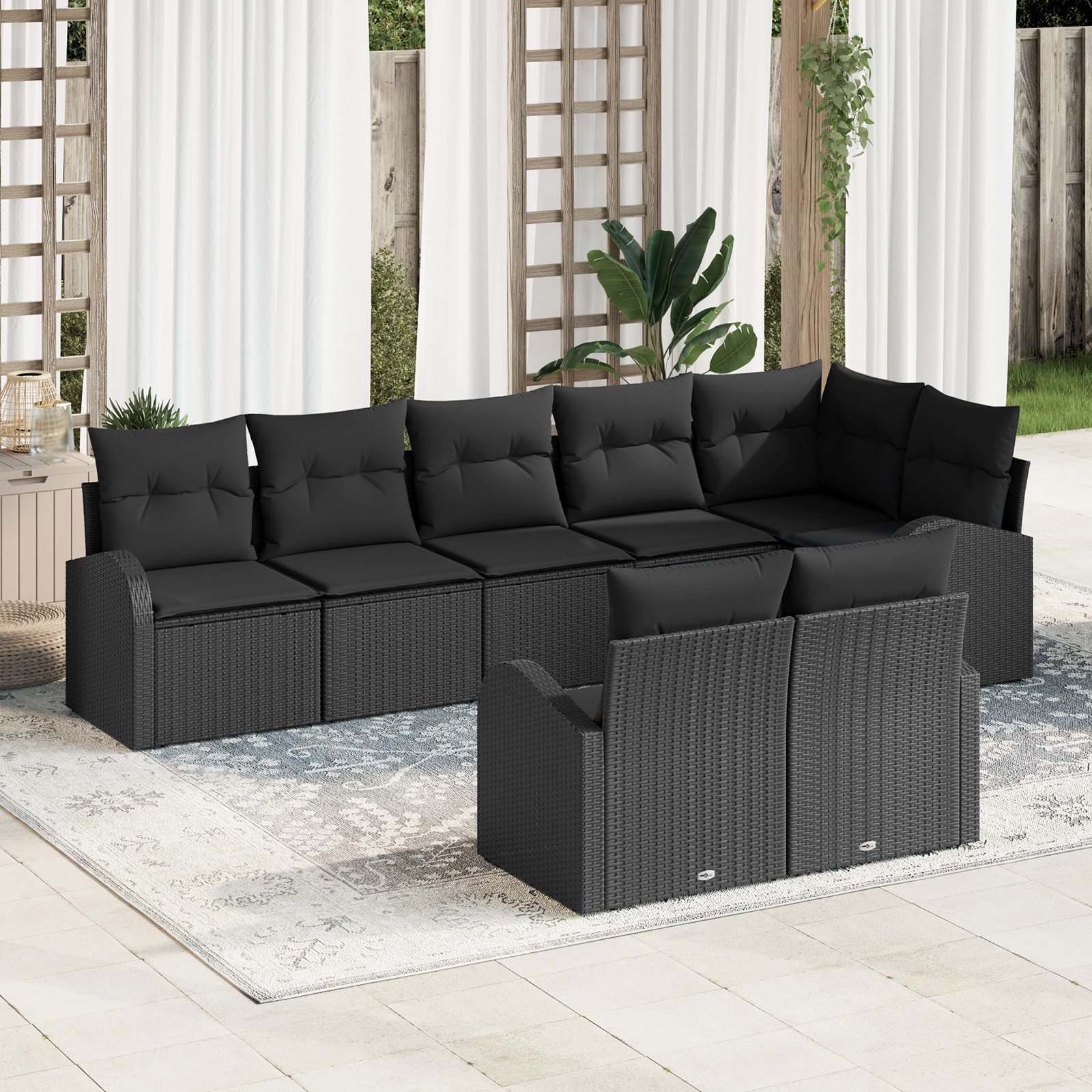 Set divano da giardino a 8 pezzi con cuscini in polyrattan nero