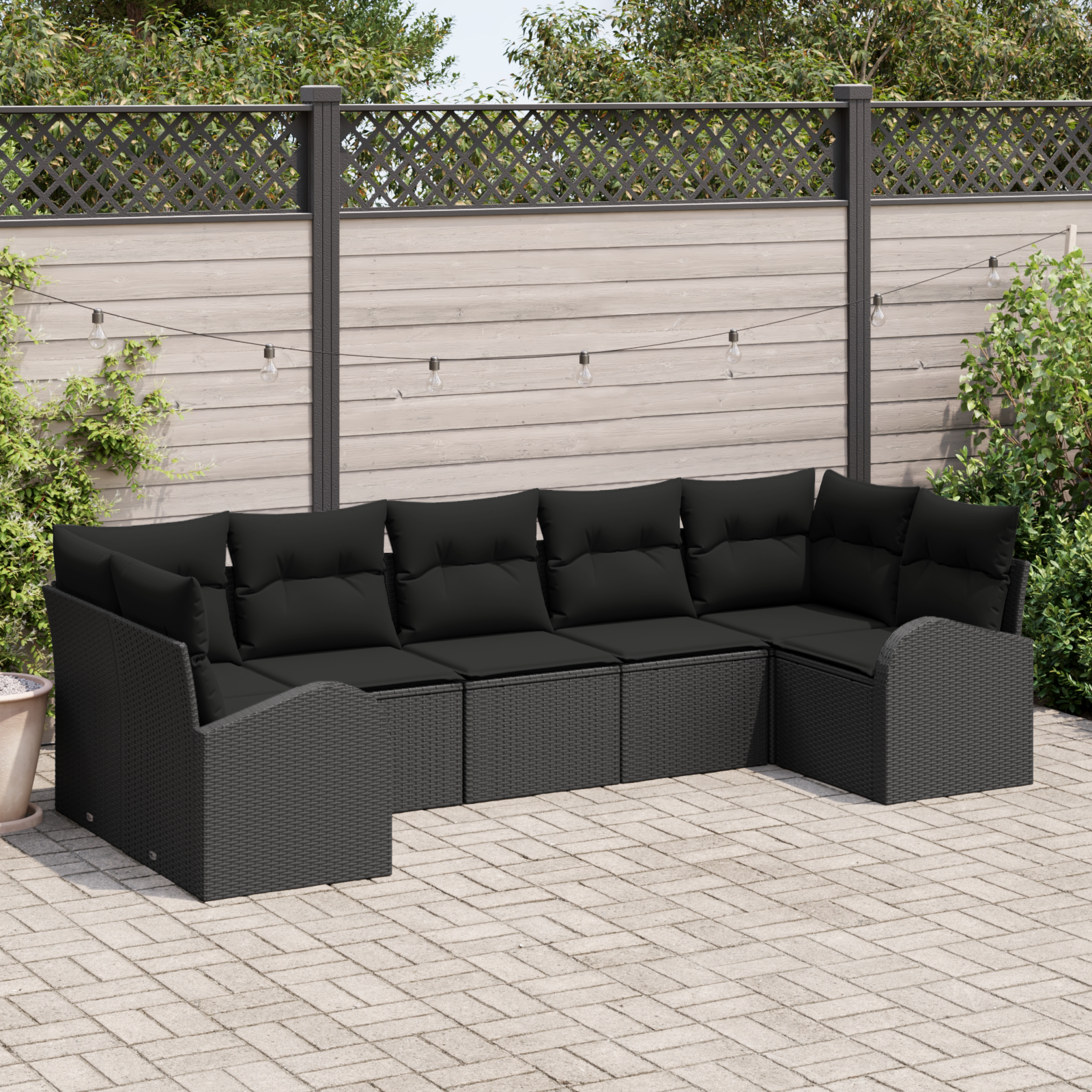Set di divano da giardino 7 pezzi con cuscini in rattan nero