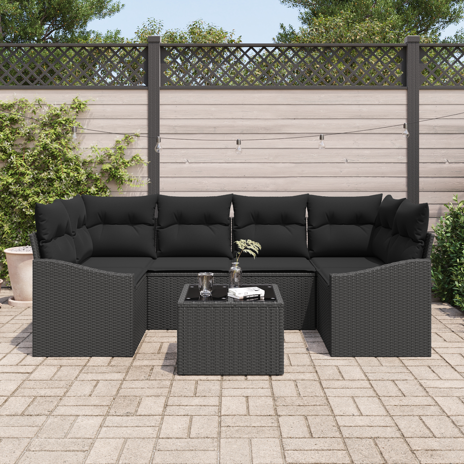 Set Divano da Giardino in 7 Pezzi con Cuscini Polyrattan Nero