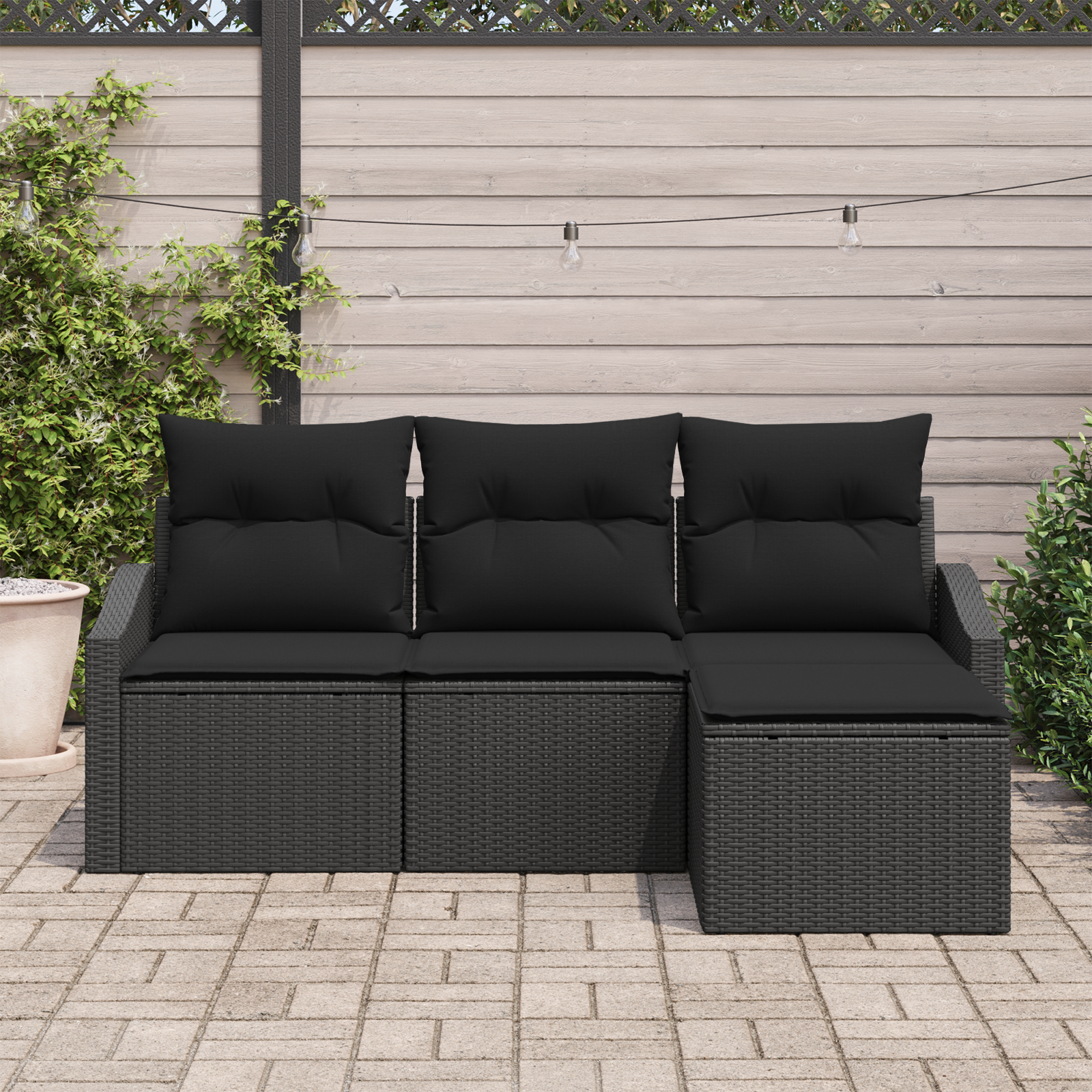 Set Divano da Giardino a 4 Pezzi con Cuscini Nero Rattan Poliestere