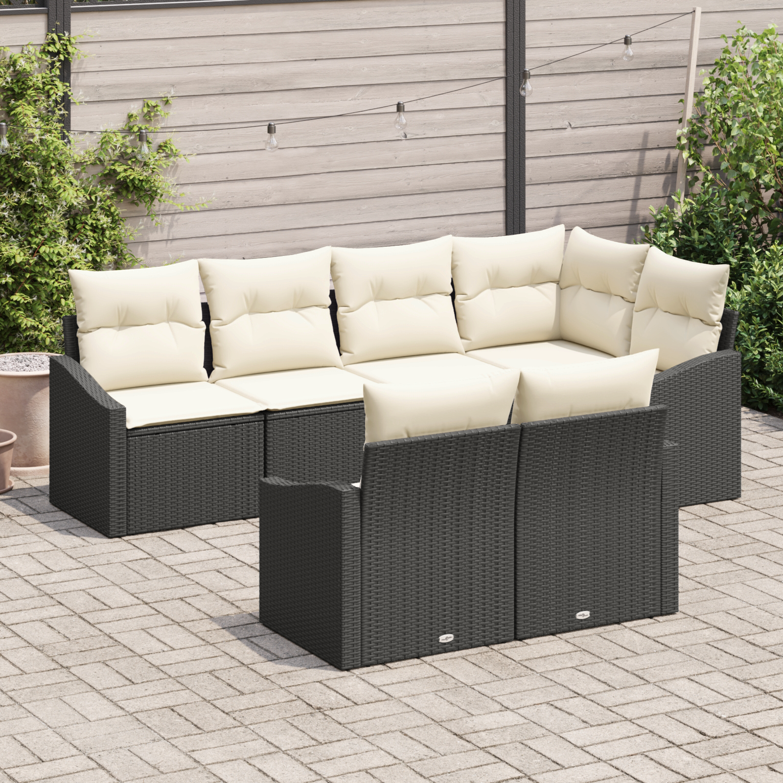 Set divano da giardino da 7 pezzi con cuscini in polyrattan nero