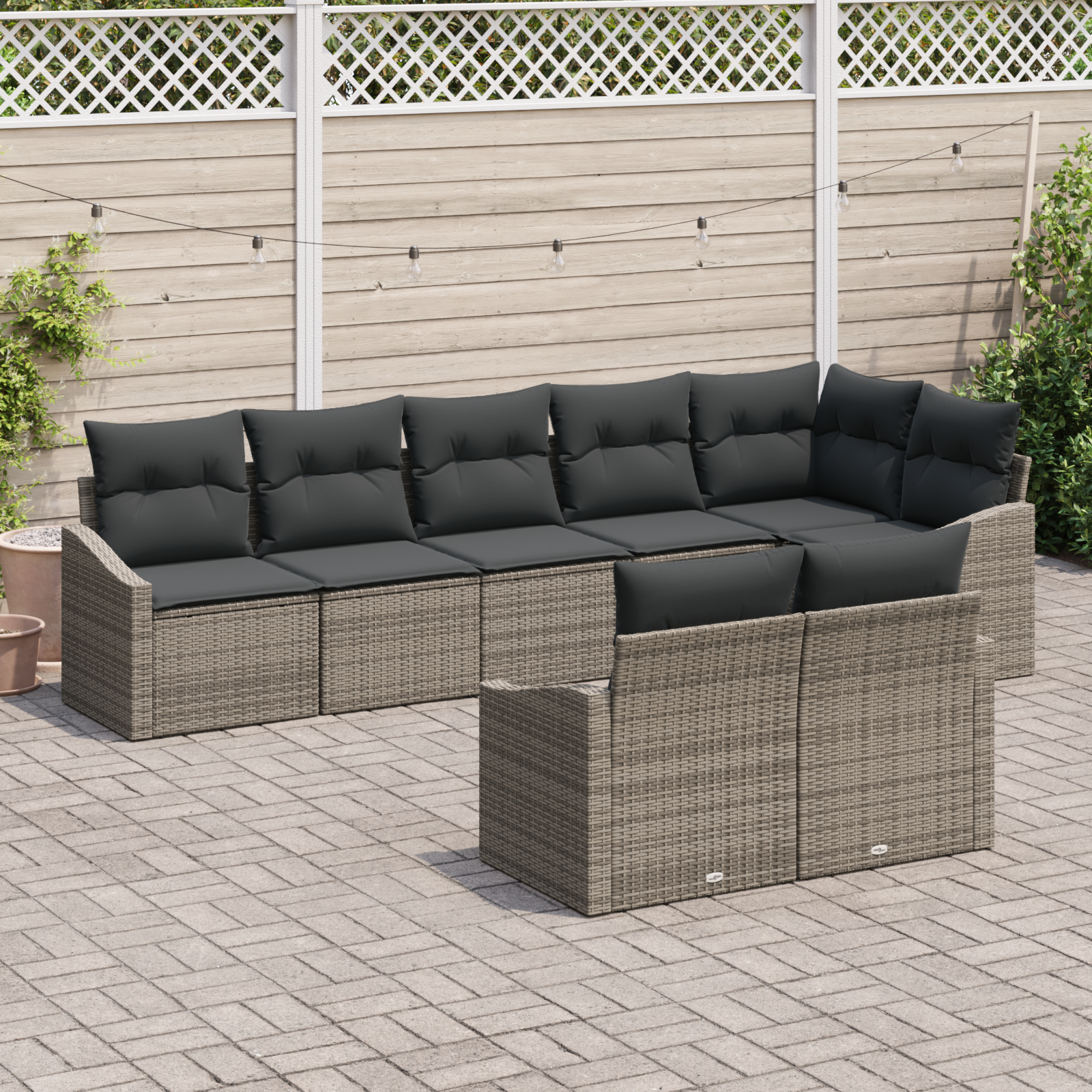 Set da giardino a 8 pezzi con cuscini in rattan grigio