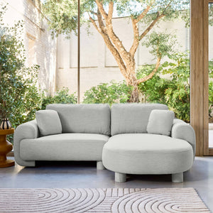 Divano ad angolo destro 3 posti in tessuto, piedi tondi, grigio chiaro