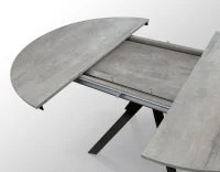 PAZZO DESIGN Tavolo Allungabile con Gambe Incrociate rotondo, Made in Italy, Basamento Nero, Grigio cemento