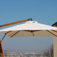 Ombrellone da giardino decentrato palo laterale in legno da 55 mm e telo esagonale in poliestere 180 gr/mq da 300x300 cm con bordura da 50 mm. Ombrellone 3x3 mt tondo con base a croce