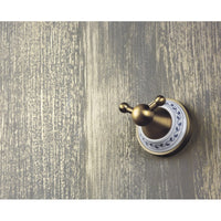 Appendiabiti doppio KERA in ottone e ceramica 6,6 x6,6 x7,4 cm