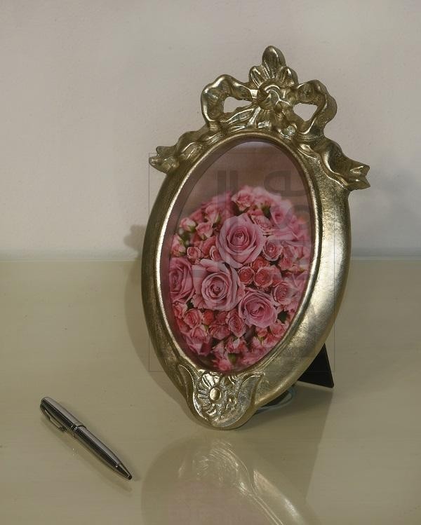 Mobili2g - portafoto in foglia argento ovale - misure: l.25 x h.34 x p.2