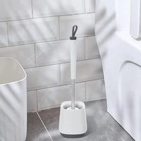 Portascopino da appoggio bianco e grigio con setole in silicone