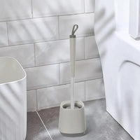 Portascopino da appoggio grigio e grigio scuro con setole in silicone