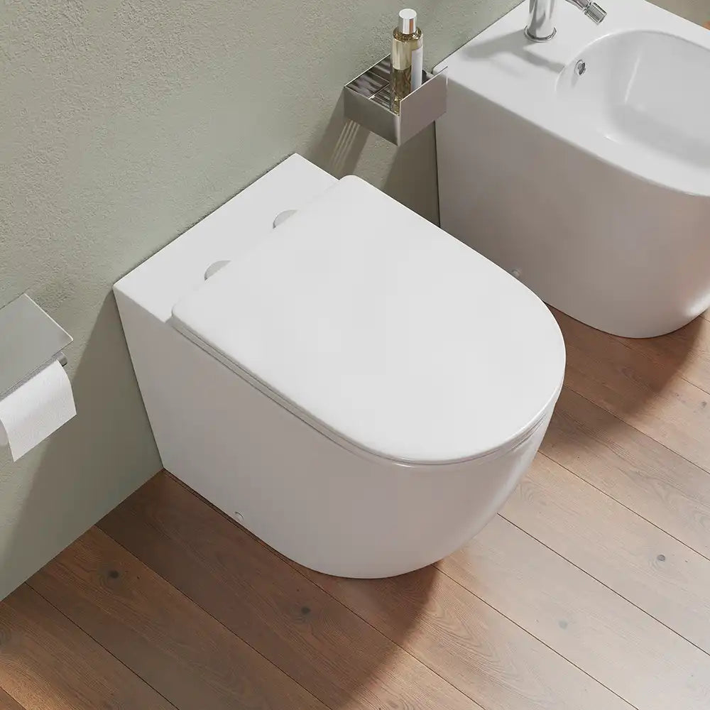 Sanitari filomuro in ceramica bianco lucido vaso rimless con copriwc soft-close e bidet | Europa