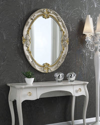 Specchiera in foglia argento ovale con particolari mecca- misure: 84 x 104 x 5