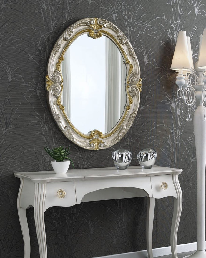 Specchiera in foglia argento ovale con particolari mecca- misure: 84 x 104 x 5