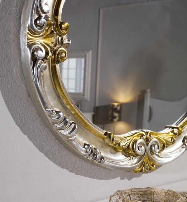 Specchiera in foglia argento ovale con particolari mecca- misure: 84 x 104 x 5