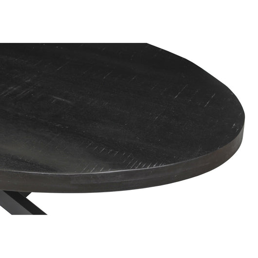 Tavolo da pranzo ovale BOURGIA in legno massiccio di Mangolia nero, ideale per una sala da pranzo accogliente.