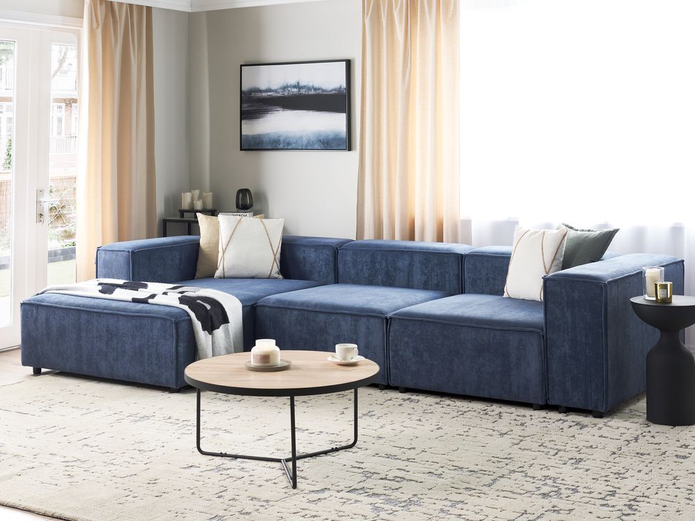Divano componibile a 4 posti con gambe nere in velluto a coste blu scuro lato destro Soggiorno moderno