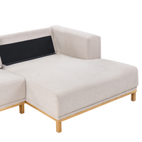 Divano angolare in velluto a coste a 5 posti con braccioli e gambe in legno beige chiaro in stile moderno