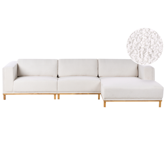 Divano angolare in bouclè a 5 posti con braccioli e gambe in legno bianco sporco in stile moderno