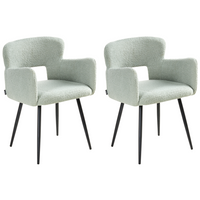 Set di 2 sedie da pranzo bouclè verde chiaro braccioli schienale intagliato gambe in metallo moderna industriale