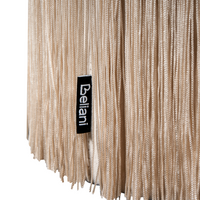 Pouf ottomana rotondo in velluto beige con pouf Glam con nappe