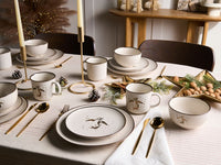 Set di 16 pezzi di stoviglie in gres  fatto a mano con finitura smaltata metallica reattiva colore bianco sporco