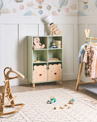 Libreria a 3 ripiani con struttura in MDF verde chiaro e gambe in legno di pino. Scaffale per camera bambini.