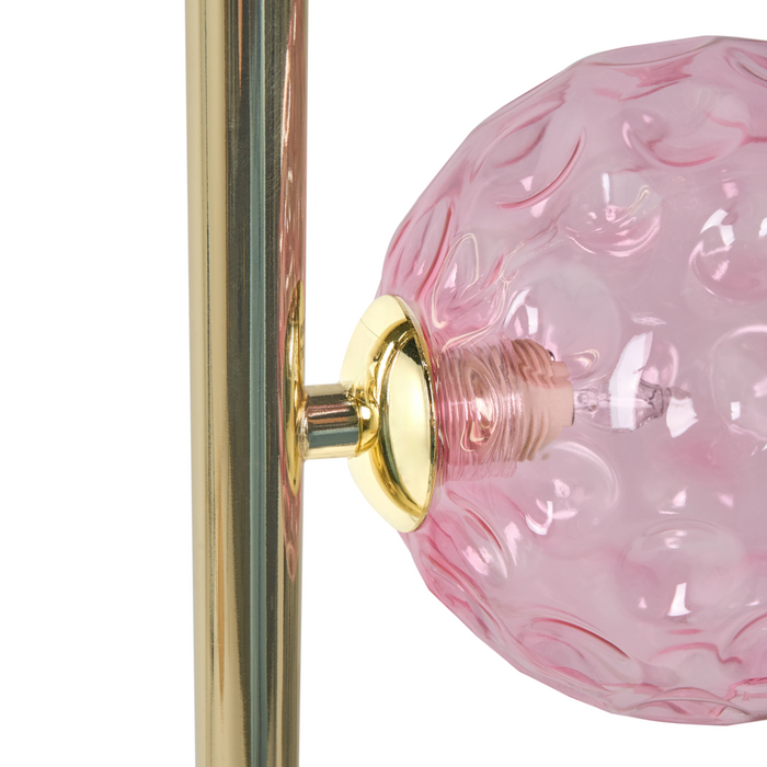 Lampada da terra in vetro beige con base in metallo rosa. Illuminazione per soggiorno dal look moderno e affascinante.
