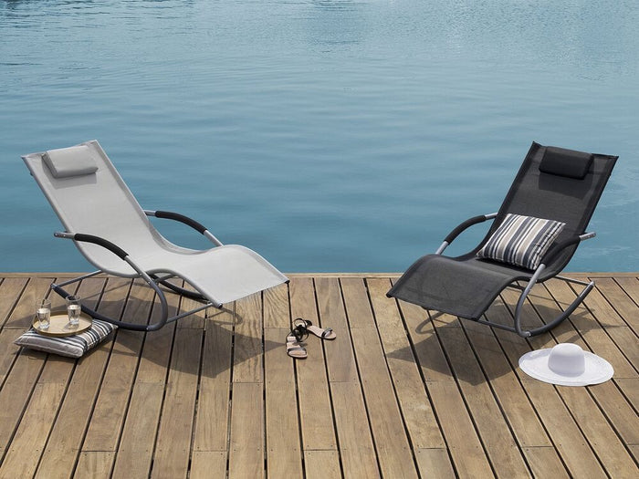 Lettino a dondolo con guide in acciaio grigio imbracatura in tessuto con cuscino per la testa