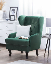 Sedia Wingback con rivestimento in velluto verde e gambe nere in stile scandinavo