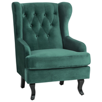 Sedia Wingback con rivestimento in velluto verde e gambe nere in stile scandinavo