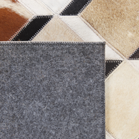 Tappeto da zona Marrone Pelle di vacchetta Patchwork Motivo geometrico a rombi Sottofondo in feltro 140 x 200 cm Paese moderno