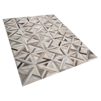 Tappeto rettangolare in pelle di vacchetta beige e marrone 140 x 200 cm Patchwork motivo geometrico retrò