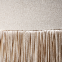 Pouf ottomana rotondo in velluto beige con pouf Glam con nappe